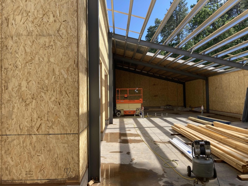 SIPs Panels Construction in progress with a Scissor lift SIPs Panels Construction in progress with a Scissor lift